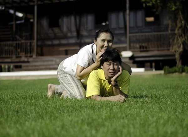 Portrait of beautiful couple in park — Stock Photo, Image