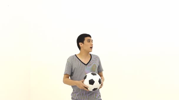 Asian man with ball by head — Stock Video