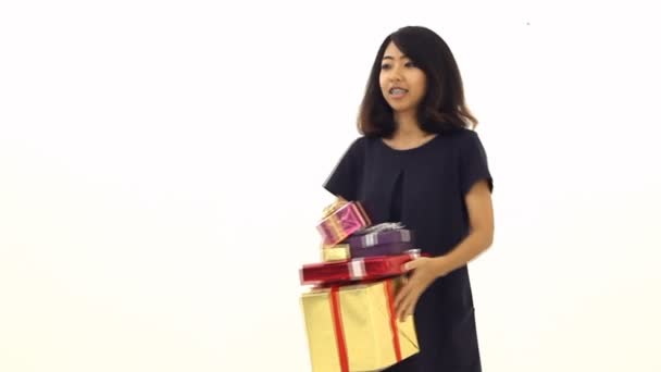 Woman tosses a lot of gift box into the air. — Stock Video