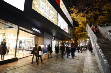 TOKYO - NOV 24: Retail shops on Omotesando Street at night clipart