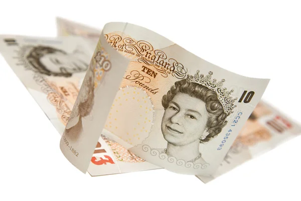 Ten pounds notes on white — Stock Photo, Image