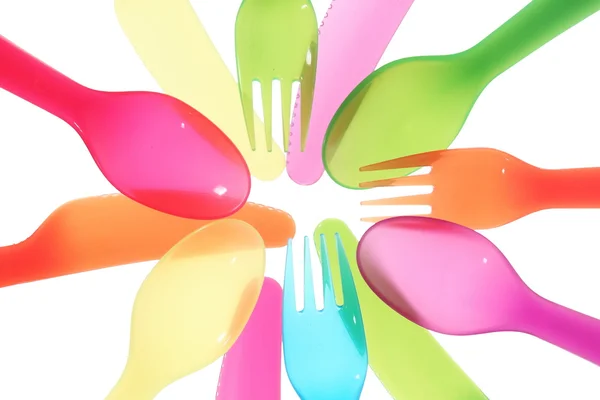 Different colors Spoon knife and fork background close — Stock Photo, Image