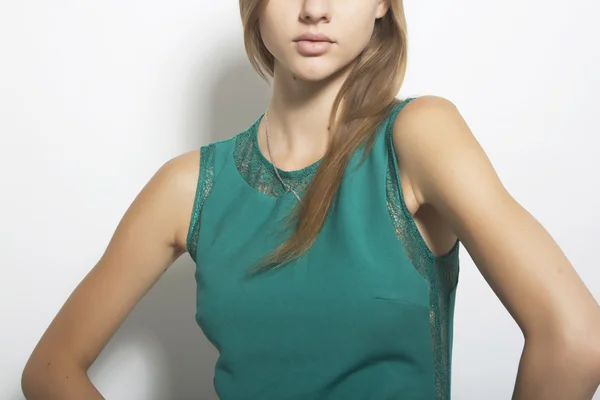 Studio shot of beautiful business woman posing in green dress isolatedin amazing shoes looking sexy iso — Stock Photo, Image