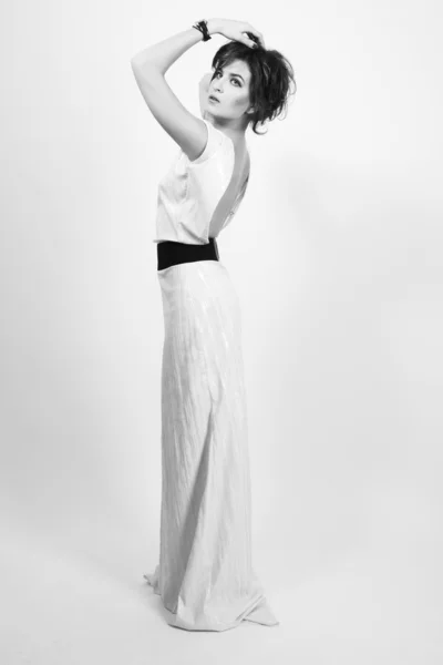 Full-length studio shot of beautiful model wearing white dress s — Stock Photo, Image