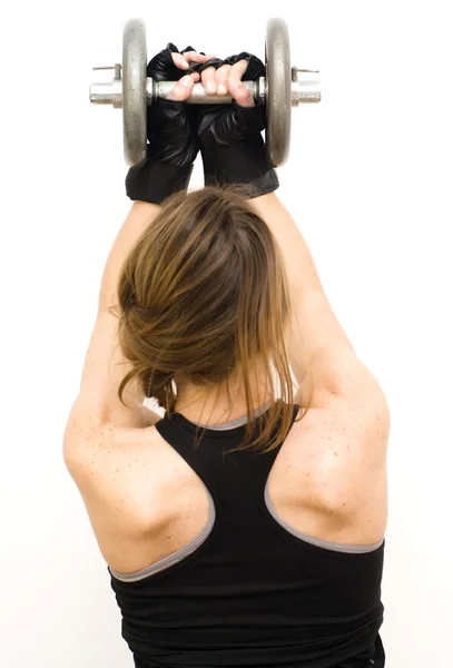 Beautiful woman lifting dumbbell — Stock Photo, Image