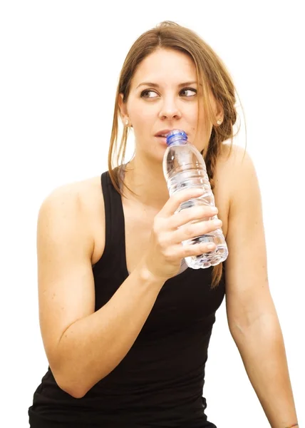 Beautiful woman drinking water after playing sports — Stock Photo, Image