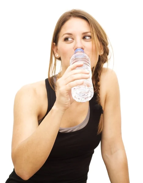 Beautiful woman drinking water after playing sports — Stock Photo, Image