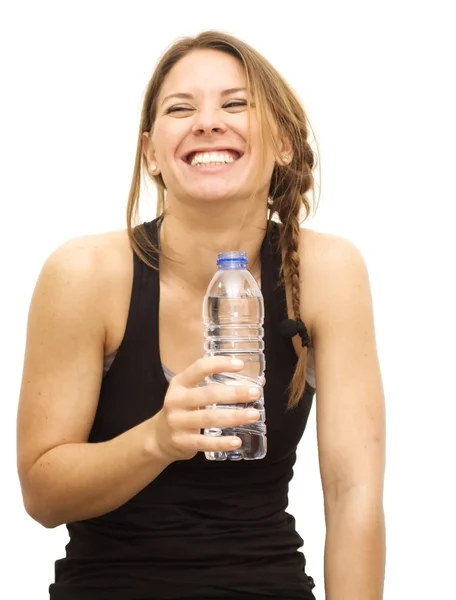 Beautiful woman drinking water after playing sports — Stock Photo, Image