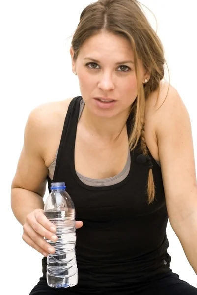 Beautiful woman drinking water after playing sports — Stock Photo, Image