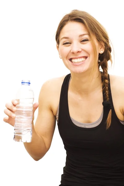 Beautiful woman drinking water after playing sports — Stock Photo, Image