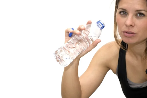 Beautiful woman drinking water after playing sports — Stock Photo, Image