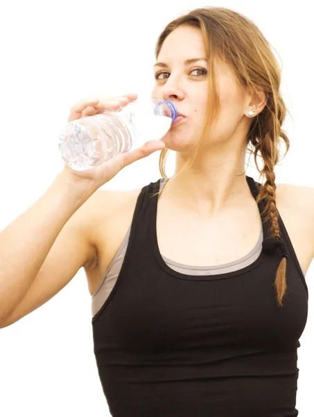 Beautiful woman drinking water after playing sports — Stock Photo, Image