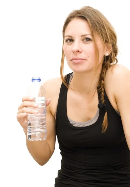 Beautiful woman drinking water after playing sports — Stock Photo, Image