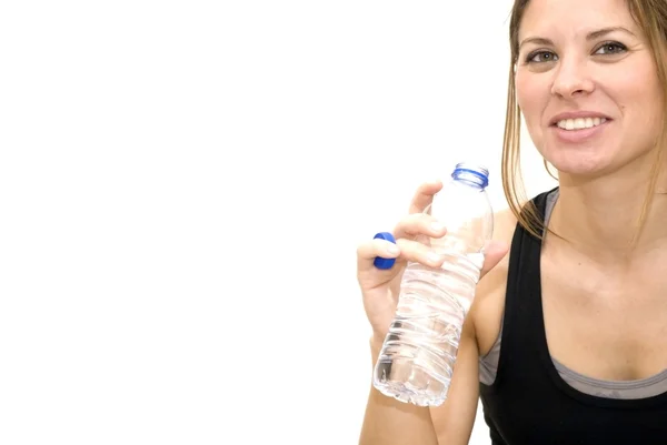 Beautiful woman drinking water after playing sports — Stock Photo, Image