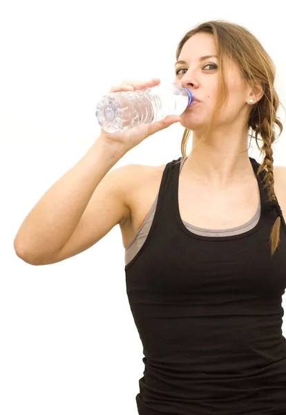 Beautiful woman drinking water after playing sports — Stock Photo, Image