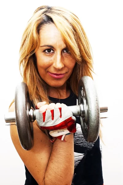 Beautiful woman lifting dumbbell — Stock Photo, Image