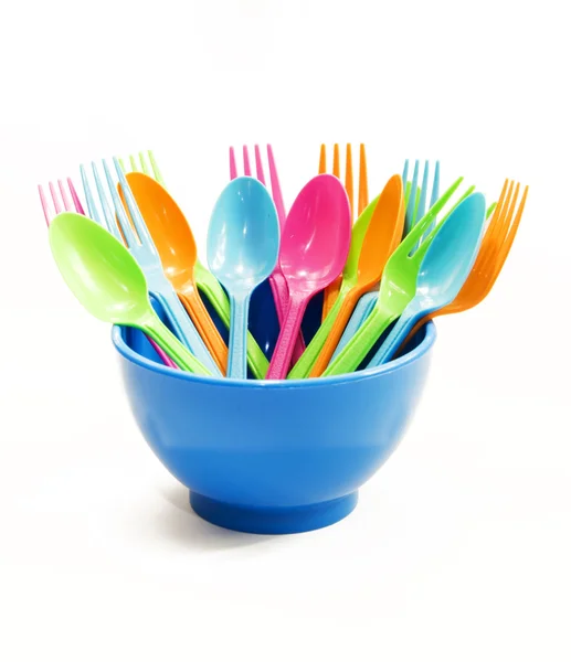 Plastic tableware consisting of spoon, fork and bowls — Stock Photo, Image