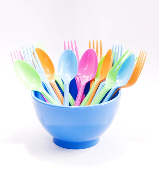 Plastic tableware consisting of spoon, fork and bowls — Stock Photo, Image