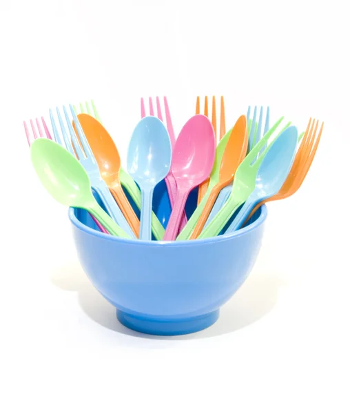 Plastic tableware consisting of spoon, fork and bowls — Stock Photo, Image