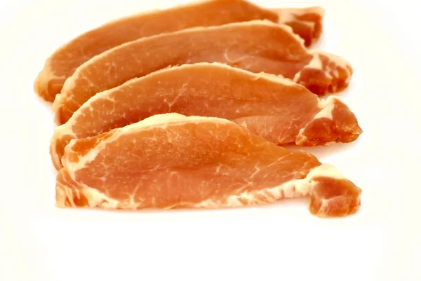 Pedaço de carne crua cortado em bifes — Fotografia de Stock