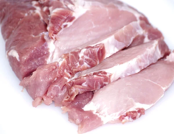 Pedaço de carne crua cortado em bifes — Fotografia de Stock