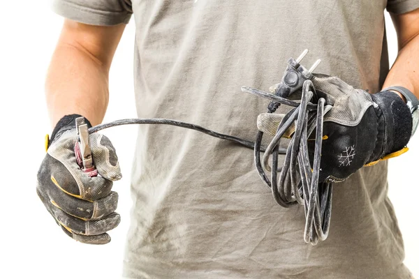 Man cuts the cable Royalty Free Stock Photos