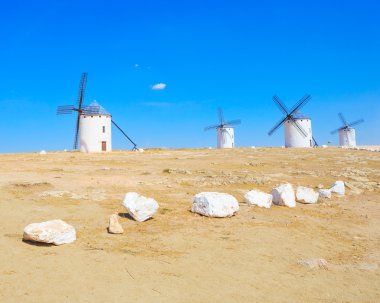 Four windmills. Campo de Criptana Castile La Mancha, Spain. clipart
