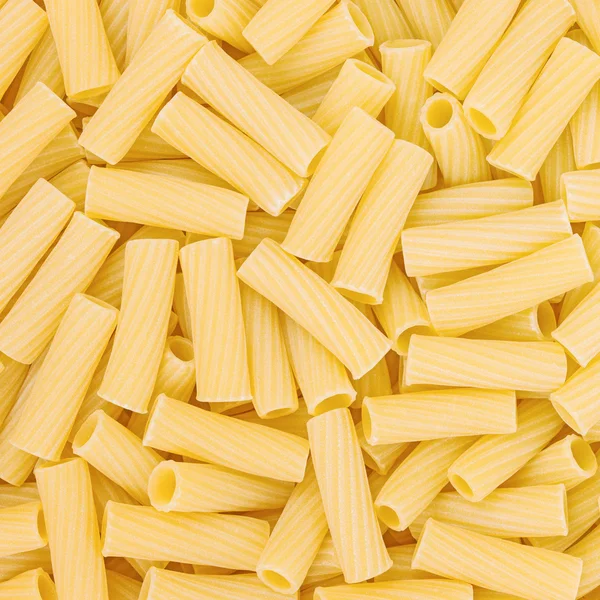 Macarrones italianos Pasta fondo o textura de alimentos crudos — Foto de Stock