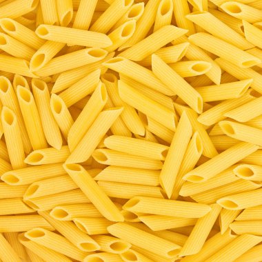 İtalyan penne rigate makarna makarna pişmemiş yiyecek arka plan veya textu