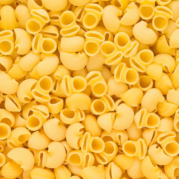 Italian Pipe Rigate Macaroni Pasta raw food background or textur — Stock Photo, Image