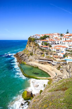 Azenhas do Mar white village, cliff and ocean, Sintra, Portugal. clipart