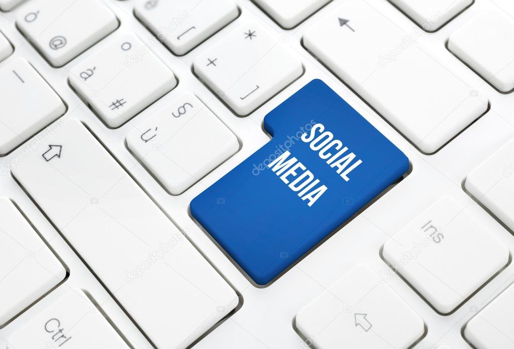 Social Media business concept blue enter button or key on white keyboard