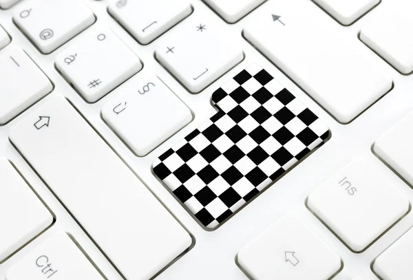 Gran Prix motor race Finish chess flag concept button or key on white keyboard — Stock Photo, Image