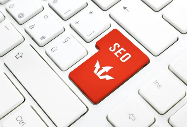 Seo business concept. Red enter button or key on white keyboard — Stock Photo, Image