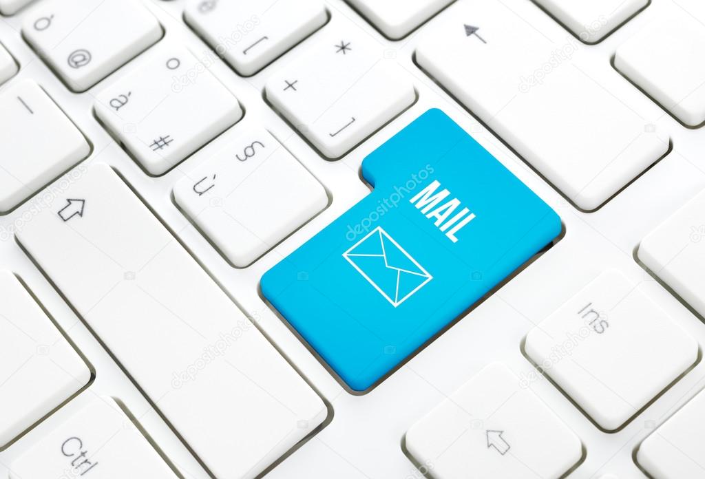 Web Mail business concept blue enter button or key on white keyboard