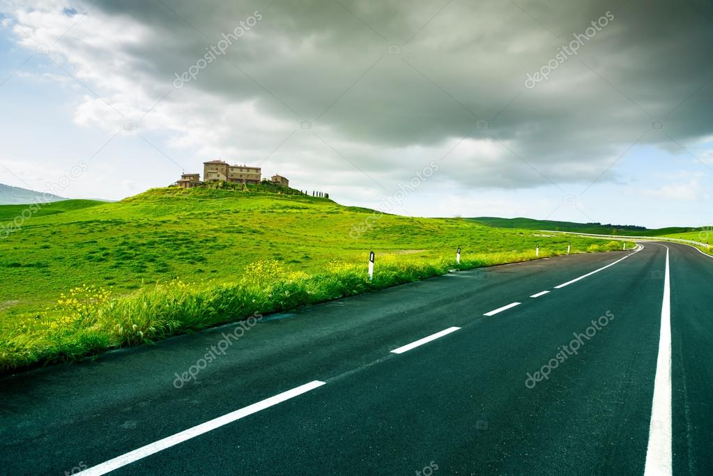 Tuscany, farm and road in Rural Landscape near Volterra in spring, Italy.