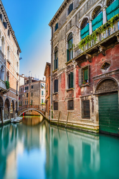 Venice cityscape, water canal, bridge and traditional buildings. Italy