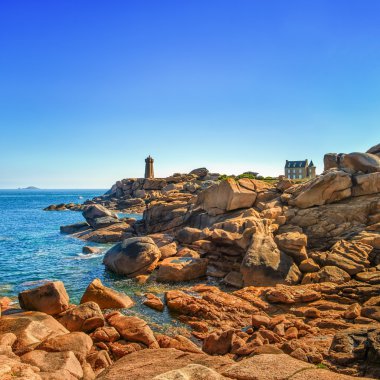 Ploumanach lighthouse morning in pink granite coast, Brittany, France. clipart