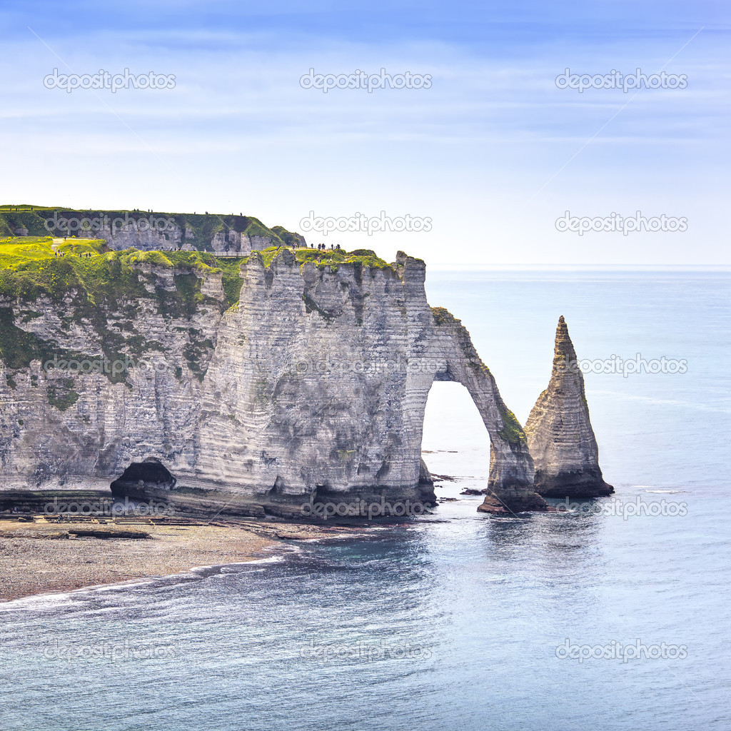 Etretat Aval cliff and rocks landmark and blue ocean . Normandy,