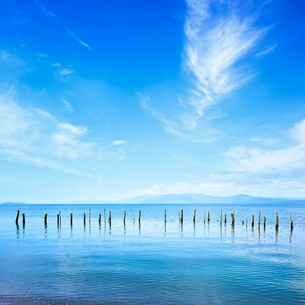 Poles and water on ocean landscape. Long exposure. — Stock Photo, Image