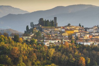 Barga medieval village at sunset in autumn. Garfagnana, Tuscany, Italy Europe clipart