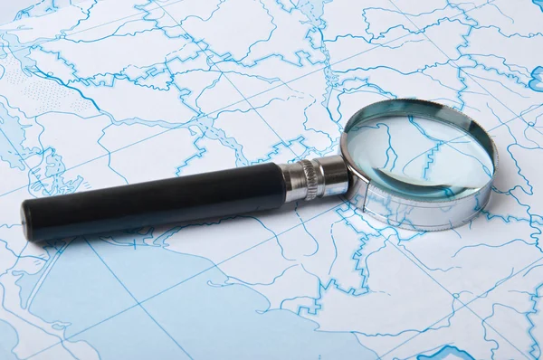 Magnifying glass on the map background — Stock Photo, Image