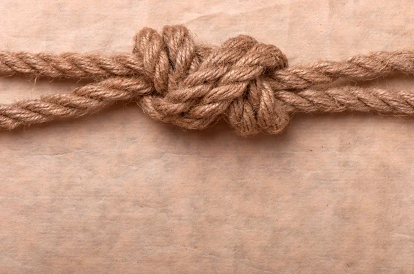 Marine knot on the background of old paper Royalty Free Stock Photos