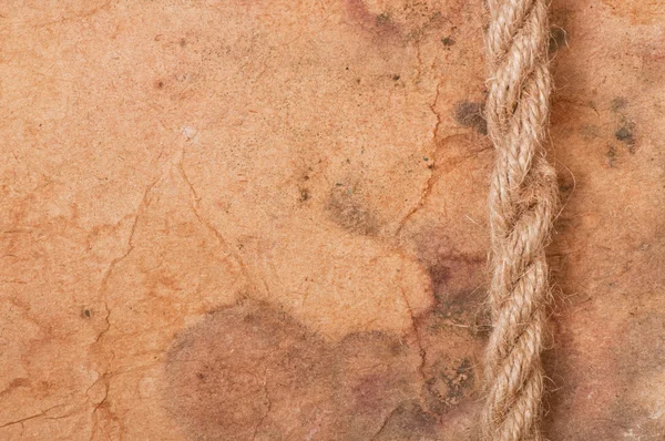 Rope on the background of old paper — Stock Photo, Image