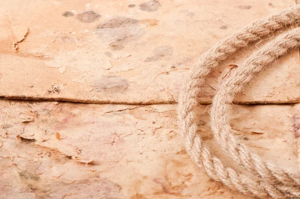 Rope on the background of old paper — Stock Photo, Image