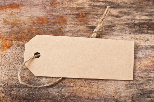 Price tag label on wooden background — Stock Photo, Image