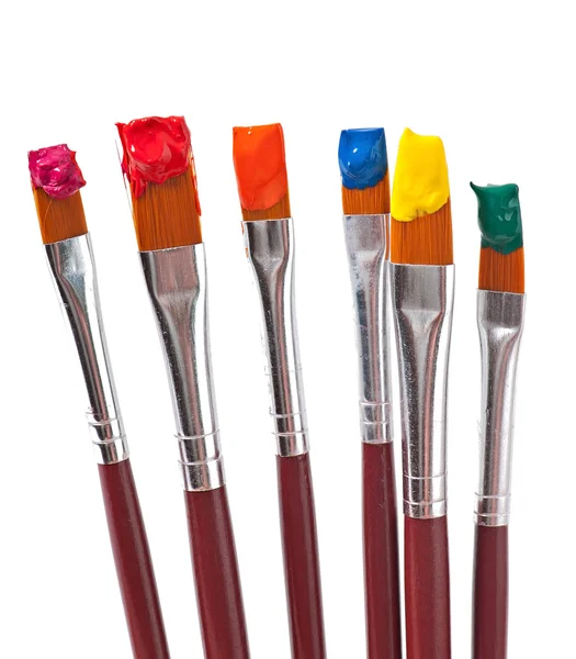 Paint brushes with paint — Stock Photo, Image