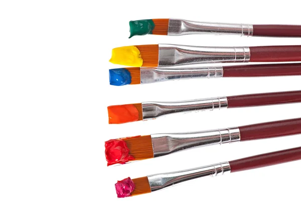 Paint brushes with paint — Stock Photo, Image