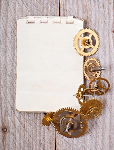 Caderno e engrenagens do relógio — Fotografia de Stock