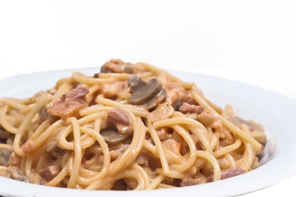 Spaghetti pasta with mushrooms sauce isolated — Stock Photo, Image